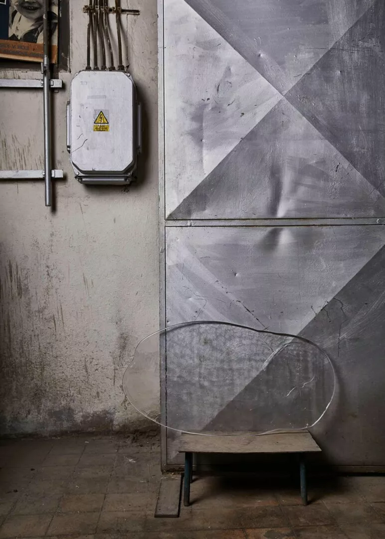 Industrial room with geometric wall and vintage electrical box.