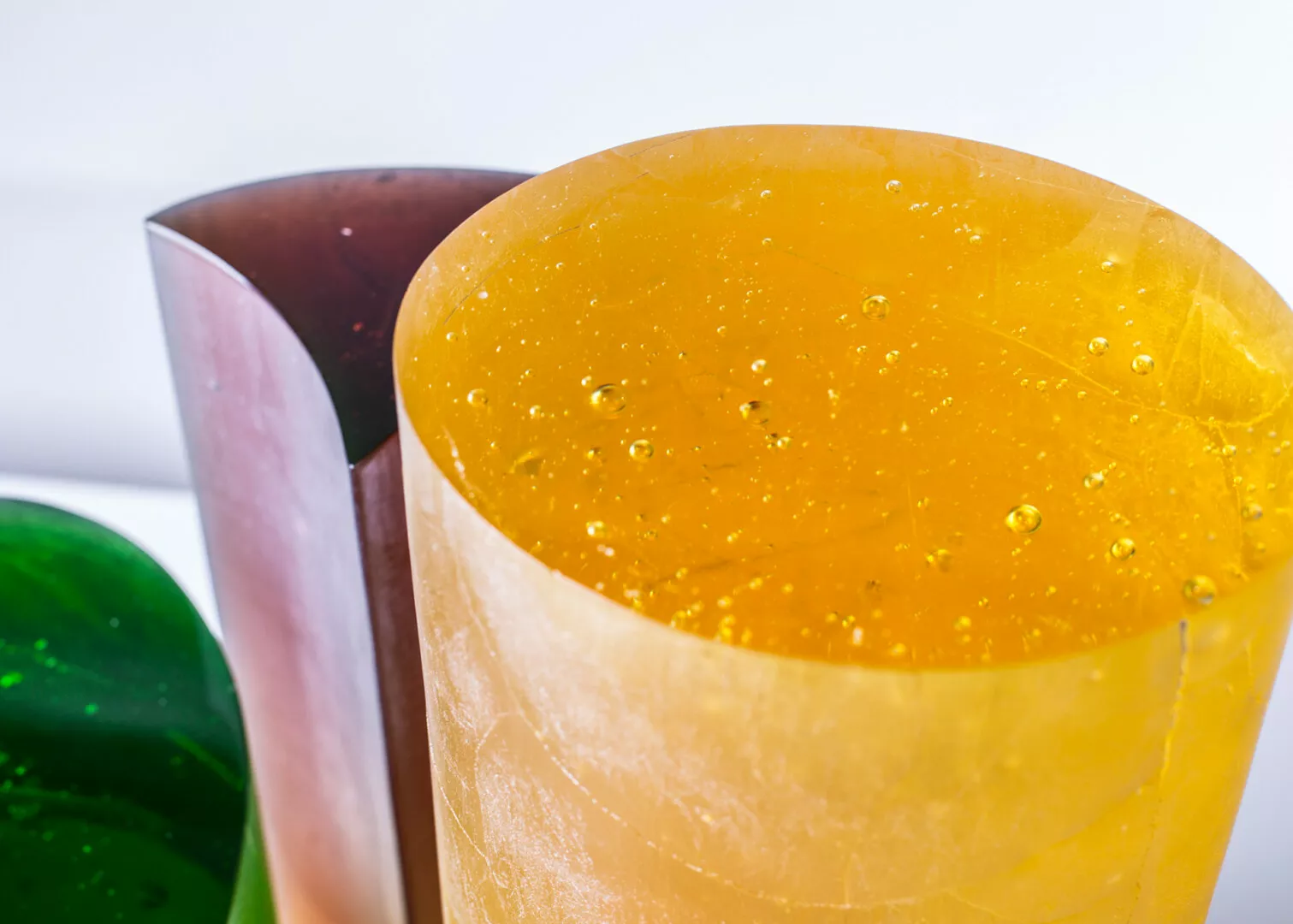 Colorful resin blocks close-up with bubbles.