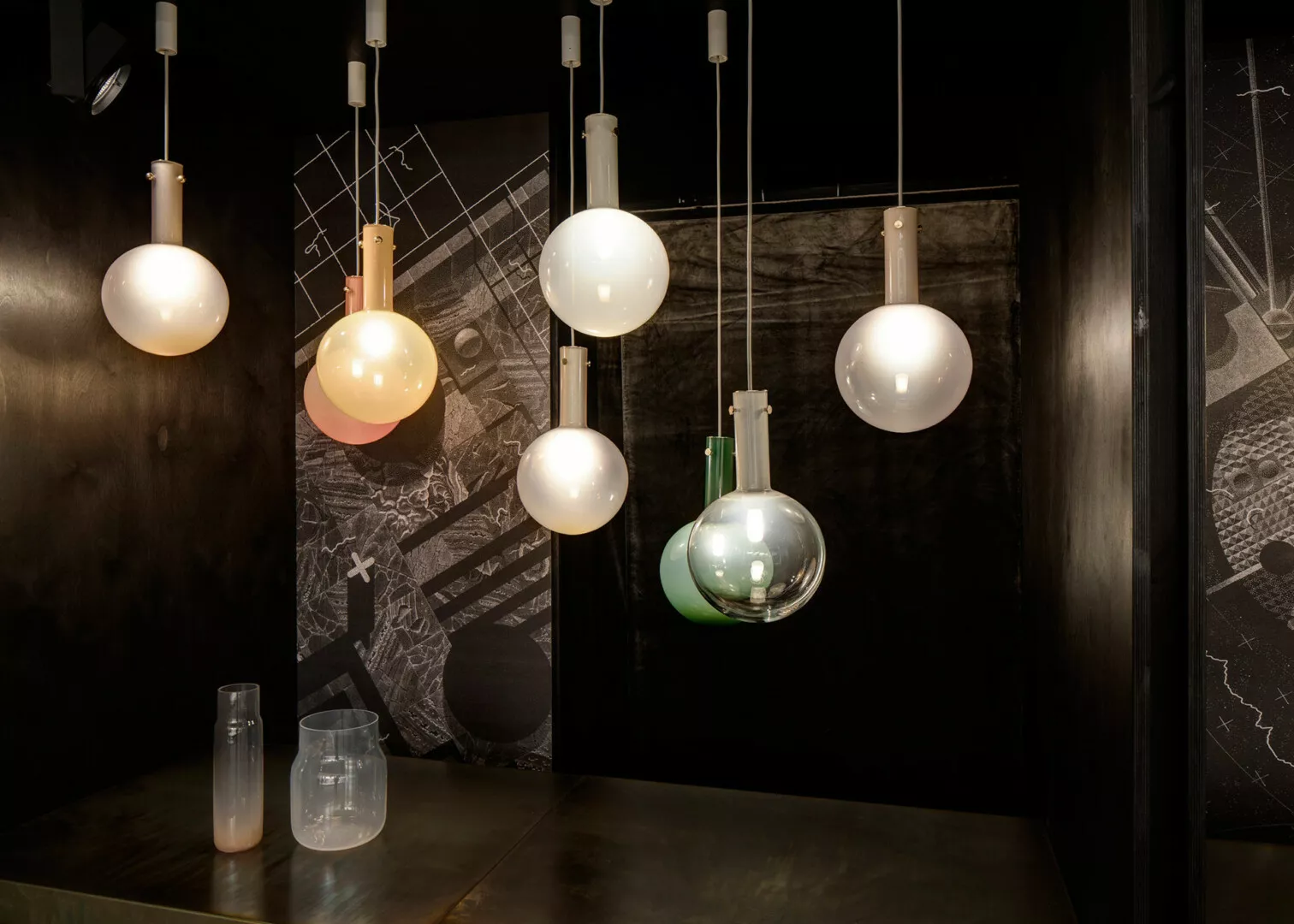 Modern hanging lights in dimly lit designer room.