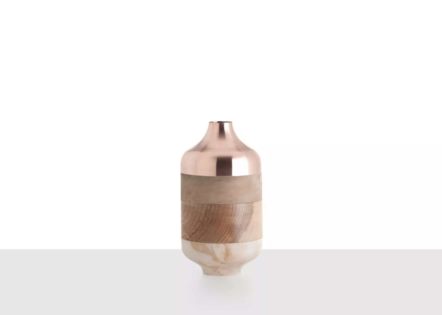 Modern copper and marble vase on white background.
