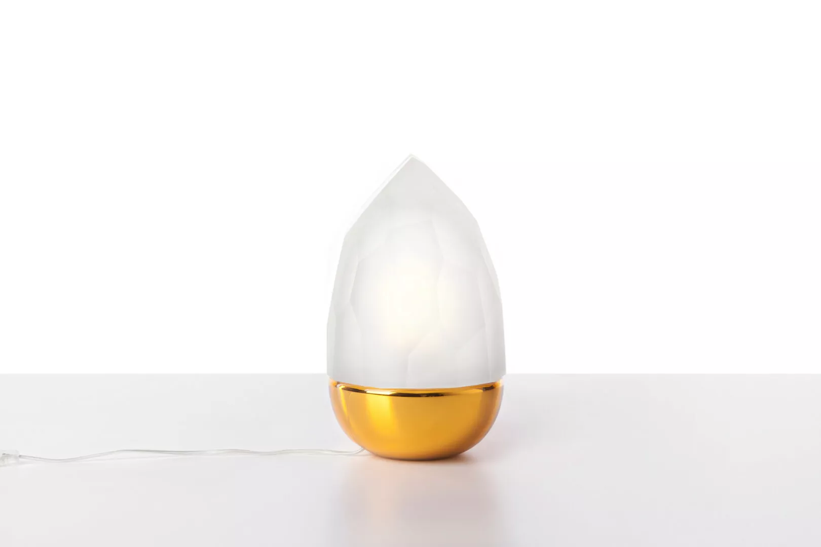 Modern white and gold diffuser on white background