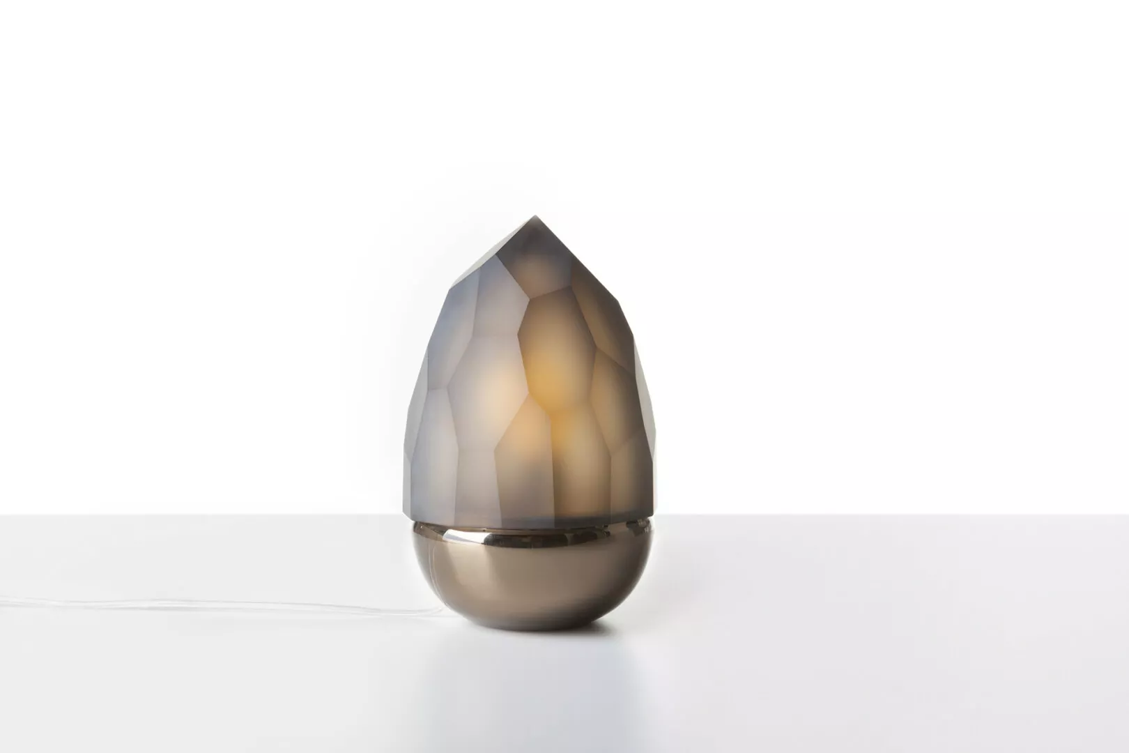 Smoky glass aromatherapy diffuser on white background