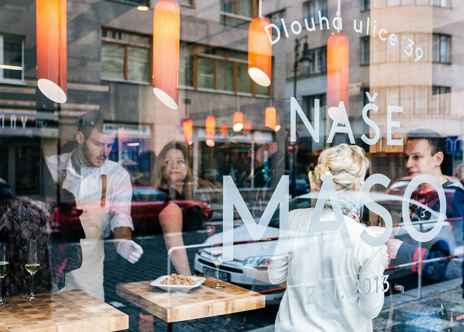 People dining inside a trendy urban restaurant.