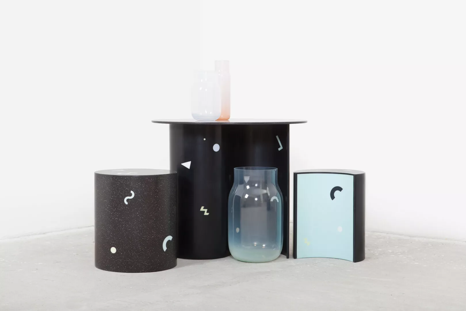 Modern furniture with celestial designs and glass accents.