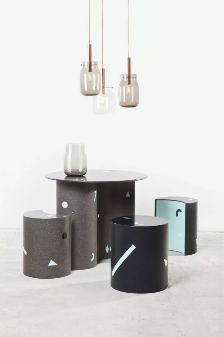 Modern geometric furniture with pendant lights.