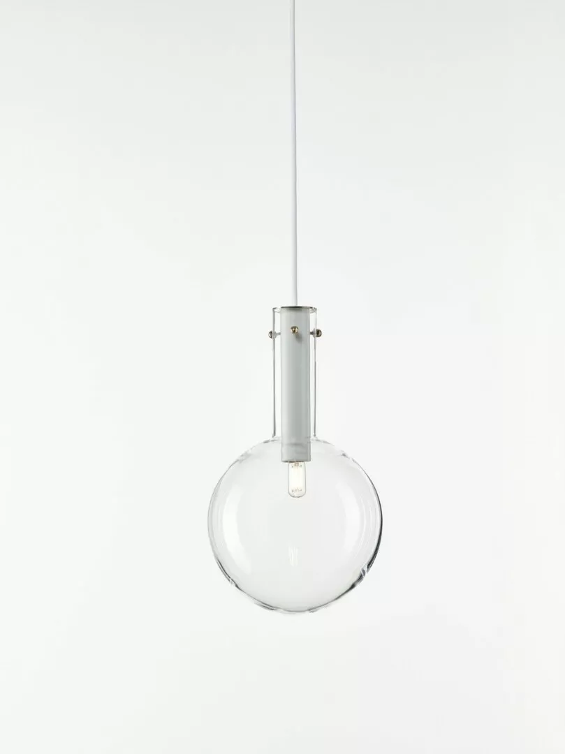 Minimalist clear glass pendant light against white background.