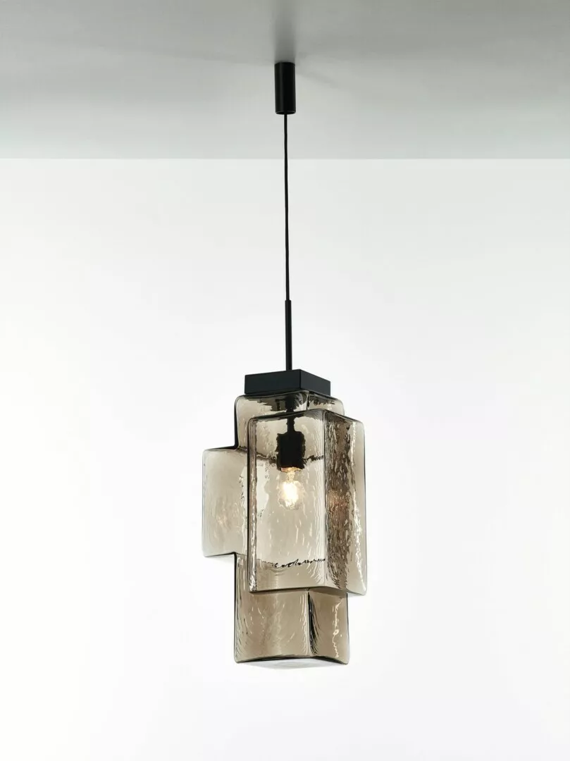 Modern hanging pendant light with textured glass panels.
