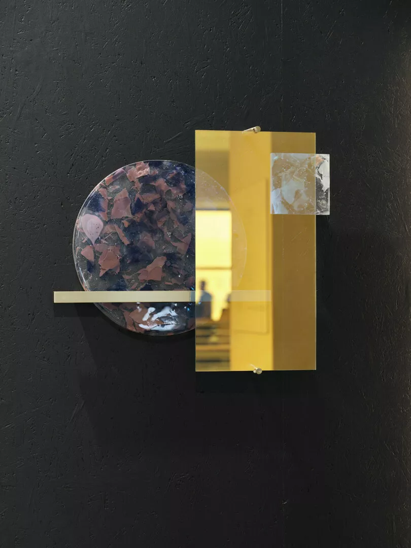 Abstract geometric wall art with circular and rectangular shapes.