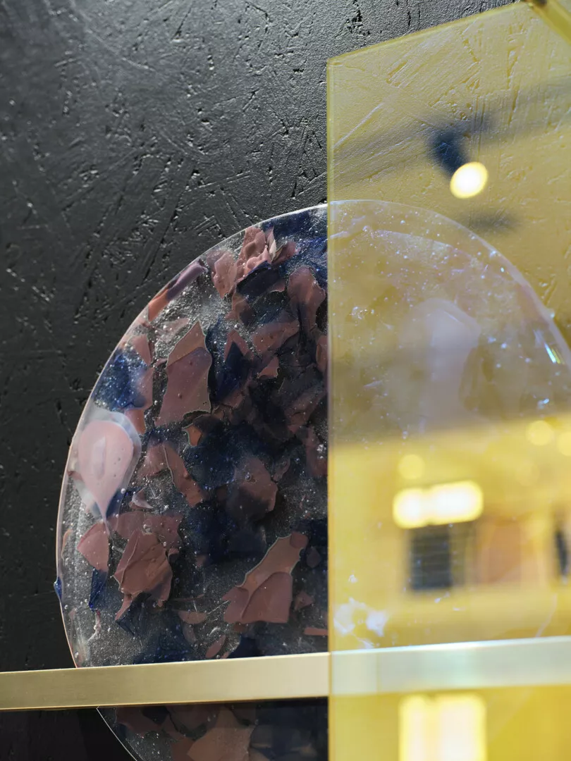 Close-up of colorful polished mineral slices in display case.