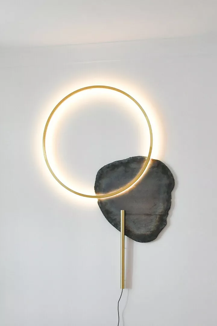 Minimalist circle light attached to stone base