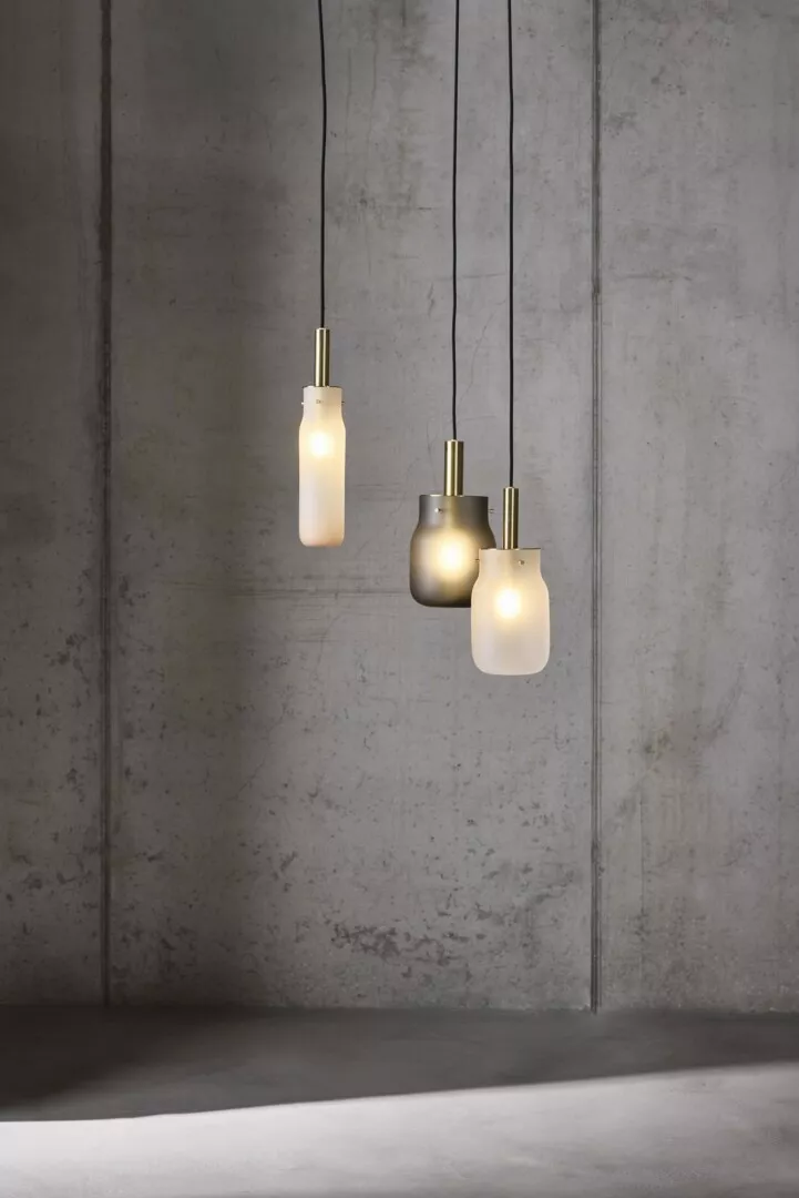 Modern pendant lights hanging in industrial-style room.