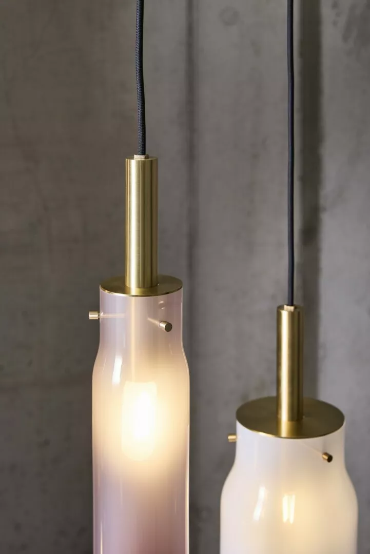 Modern hanging pendant lights, brass and frosted glass.